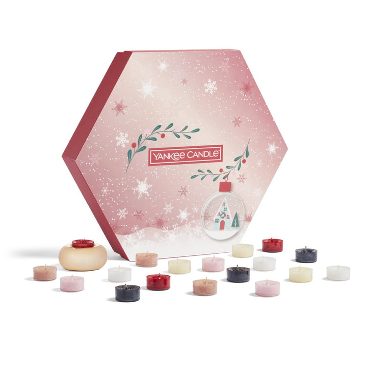 A festive gift set featuring 18 scented tea lights from Yankee Candle, elegantly presented in a joyful winter-themed box.