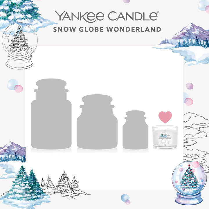 Three elegantly designed Yankee Candle votives, each filled with a delightful fragrance, perfect for cozy evenings.