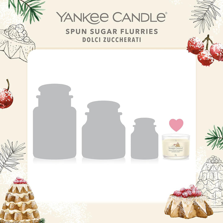 Three Sugar Spun Flurries-scented Yankee Candle votives bundled together, adding a touch of festive cheer to your home decor.