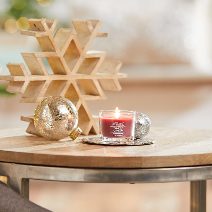 Three pack of Peppermint Pinwheels Yankee Candle votives, perfect for creating a cosy atmosphere during the holidays.