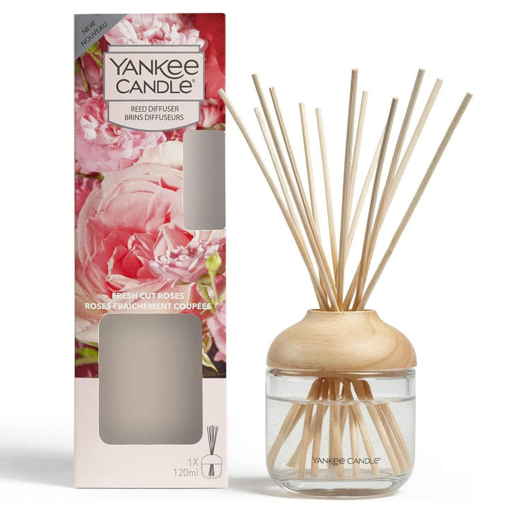 Yankee Candle's Scented Reed Diffuser features the delightful fragrance of Fresh Cut Roses, infusing your space with the beauty of blooming rose petals.