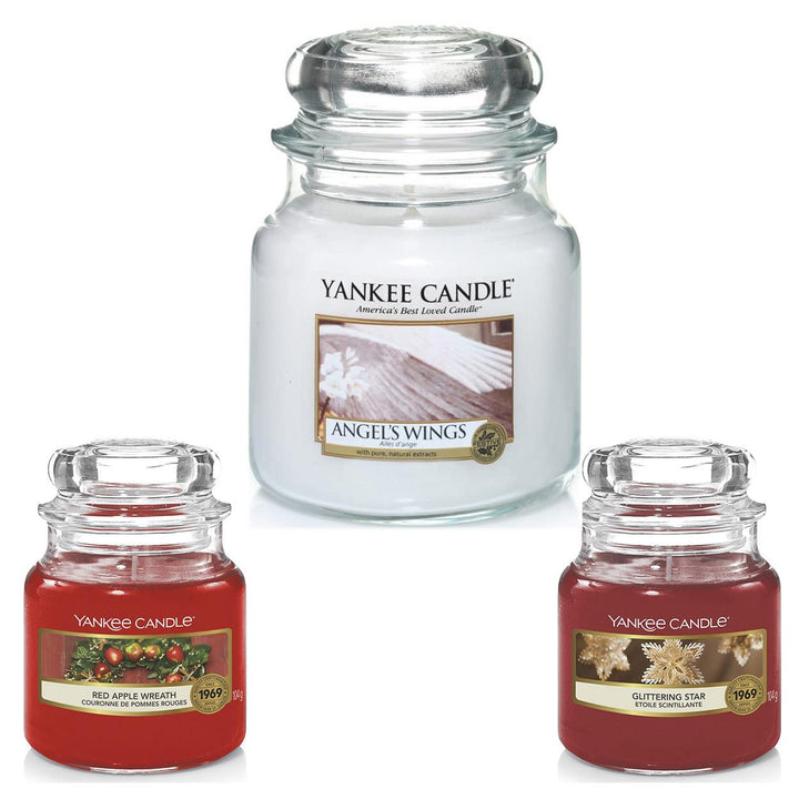 An assortment of Christmas-scented votive candles in the Yankee Candle gift set.