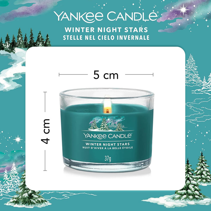 Experience the essence of a crisp winter night with Yankee Candle's scented votives. This pack of three features a Winter Night Stars design, filling your space with a cosy, festive aroma.